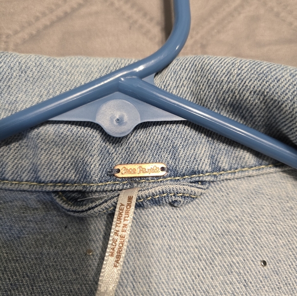 Free People classic cut denim jacket adorned with pearl accents. - Picture 7 of 9